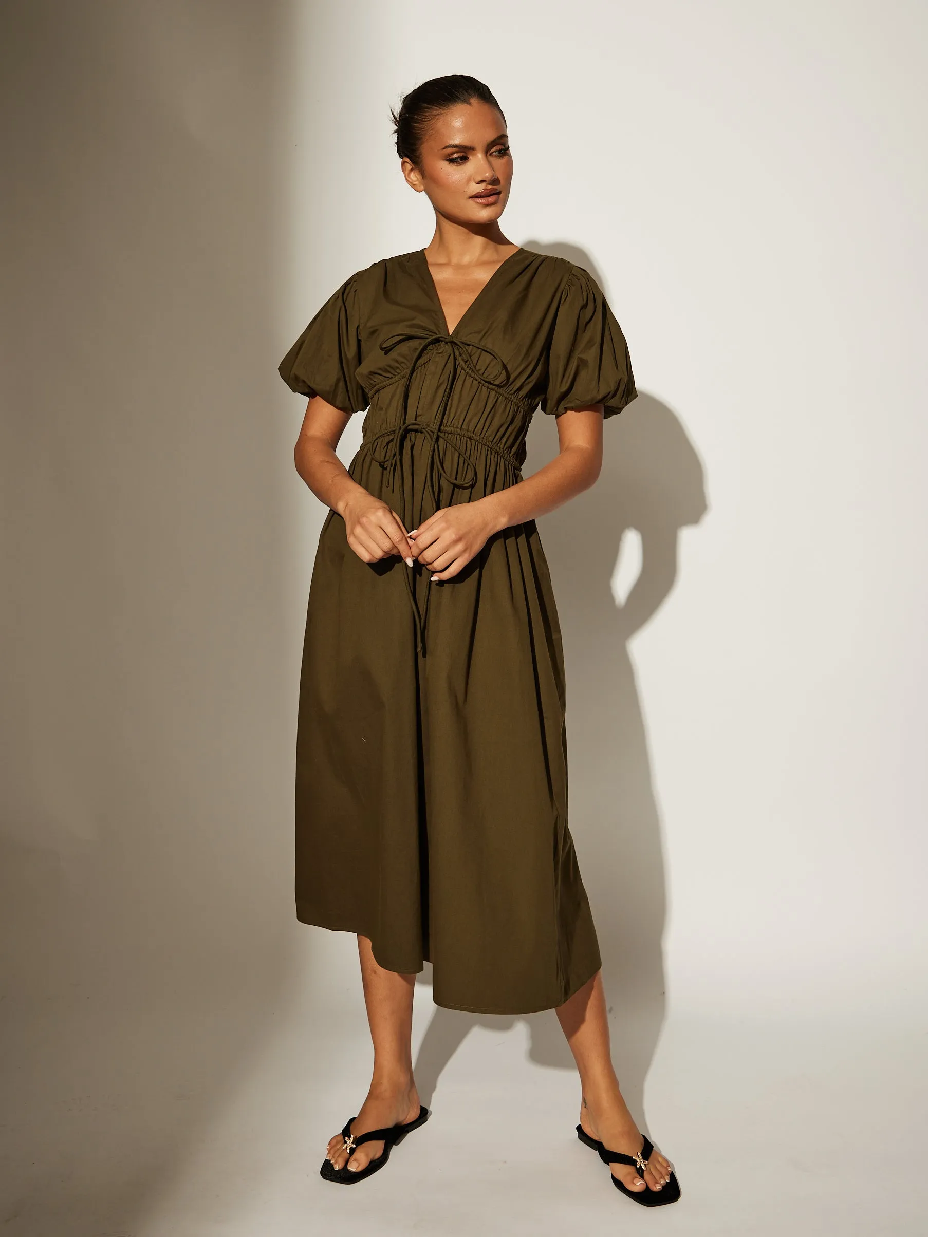 the ‘boma’ tie front midi dress  with puff sleeves in khaki